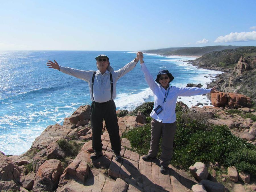 Walkers standing on a lookout on the cape to cape trail