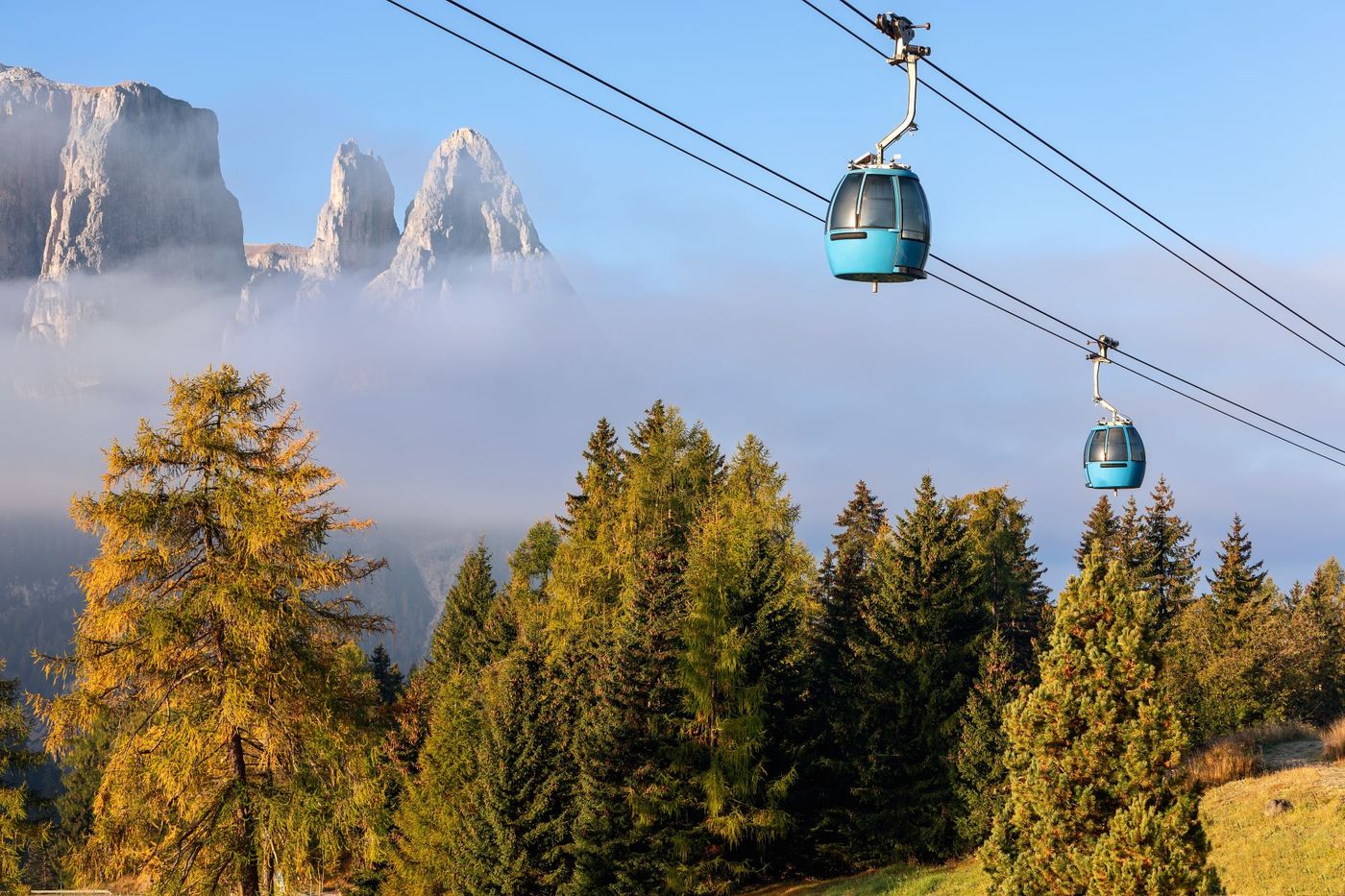Gondolas-Gliding-Over-an-Autumn-Forest-in-Dolomites