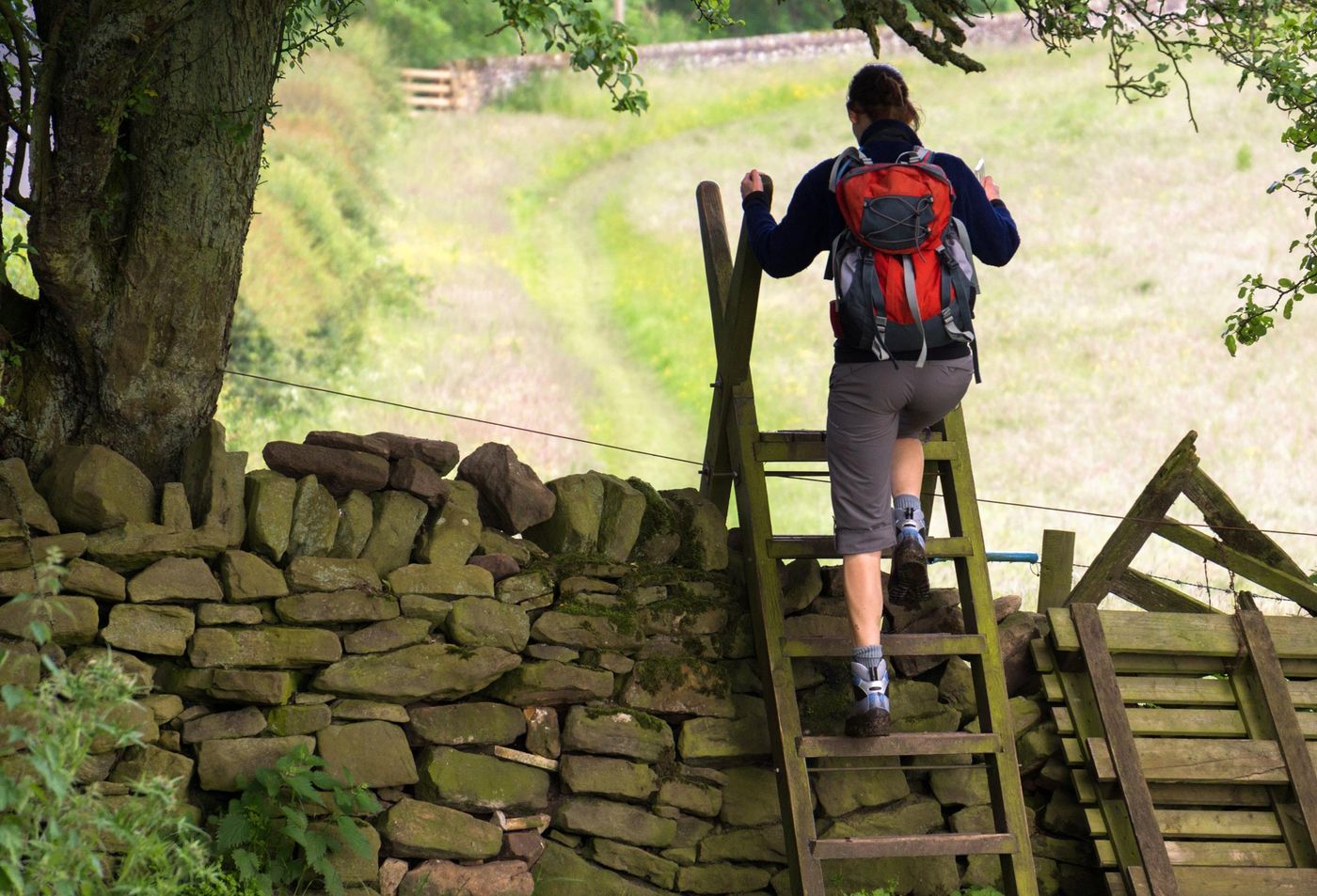 Hadrians Wall Walker over stile