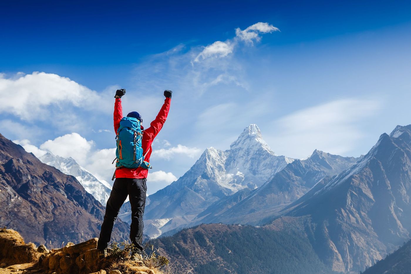 Hiker Elated at top view Ama Dablam
