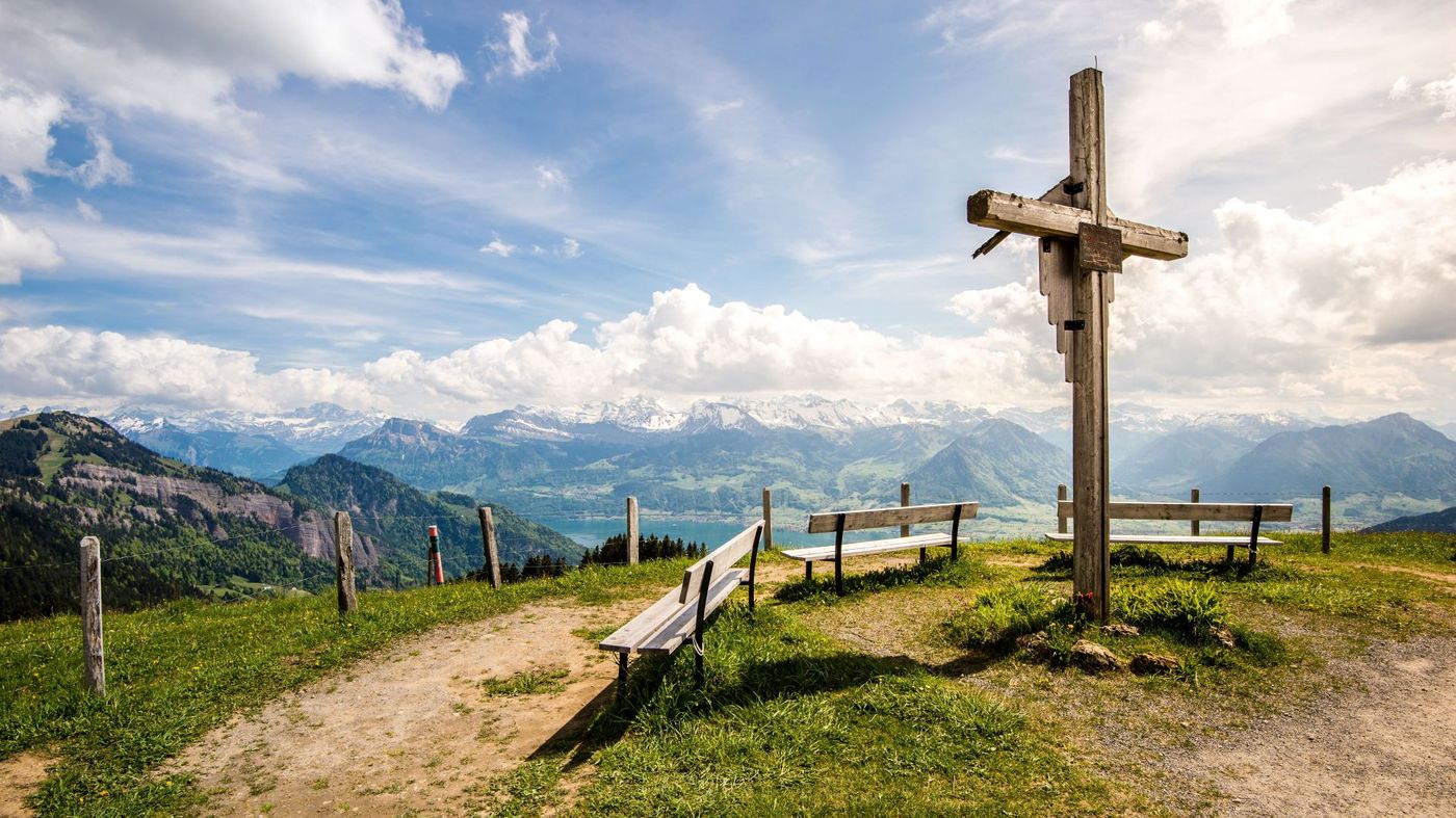 Large wooden summit cross at a scenic viewpoint on Mount Rigi near Kaltbad overlooking Lake Lucerne