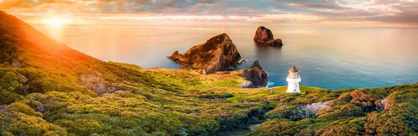 Sunset-over-Cape-Brett-Lighthouse-and-Bay-of-Islands