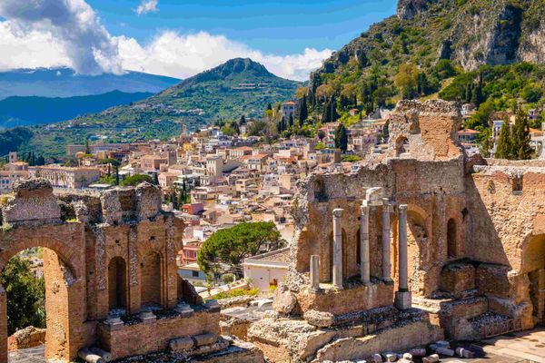 Taormina on Sicily, Italy. Ruins of ancient Greek theater, mount Etna covered with clouds. sm