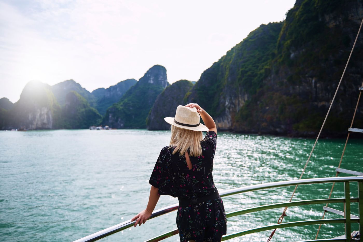 Woman,Admiring,Rock,Formations,In,Ha,Long,Bay,Vietnam