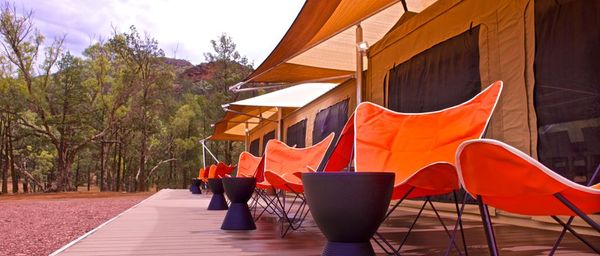ikara safari camp tent chairs in a row